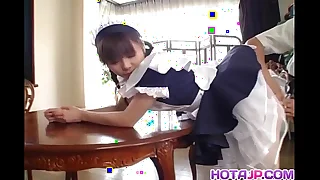 Alluring Asian maid Natsumi exposes hot pussy for fingering